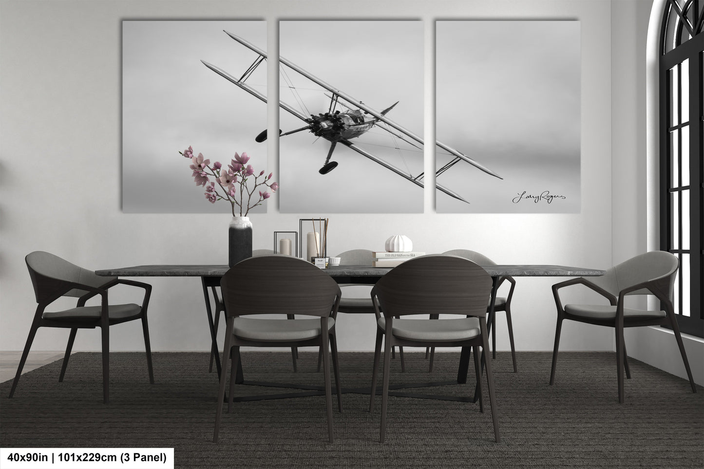 a black and white photo of a dining room