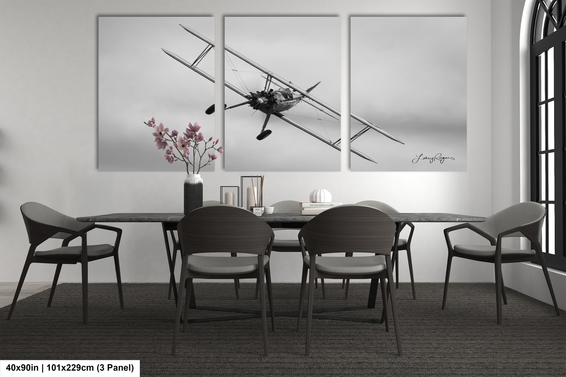 a black and white photo of a dining room