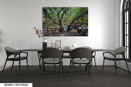 a dining room table with chairs and a painting on the wall