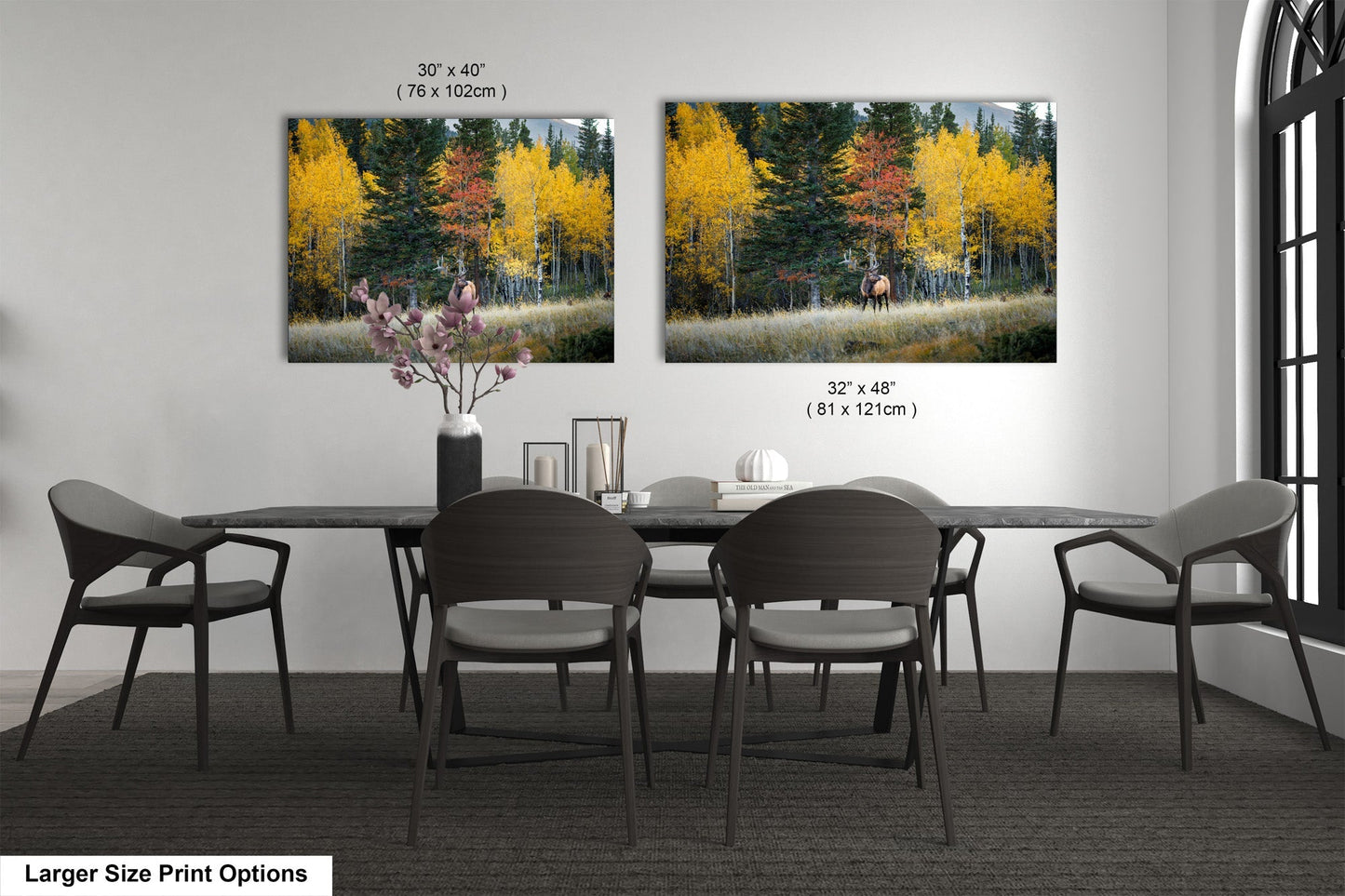 a dining table with four chairs and a vase of flowers