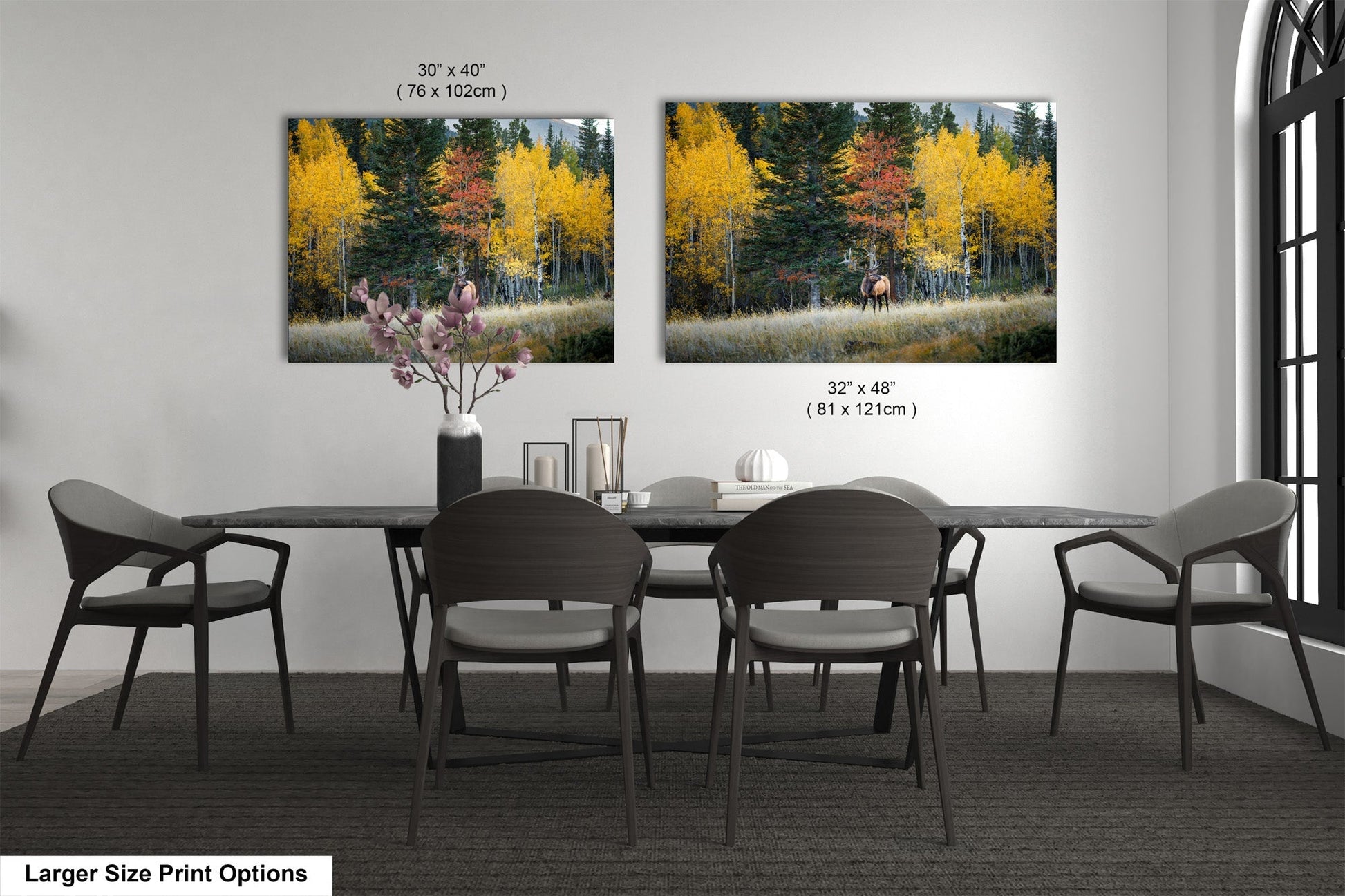 a dining table with four chairs and a vase of flowers