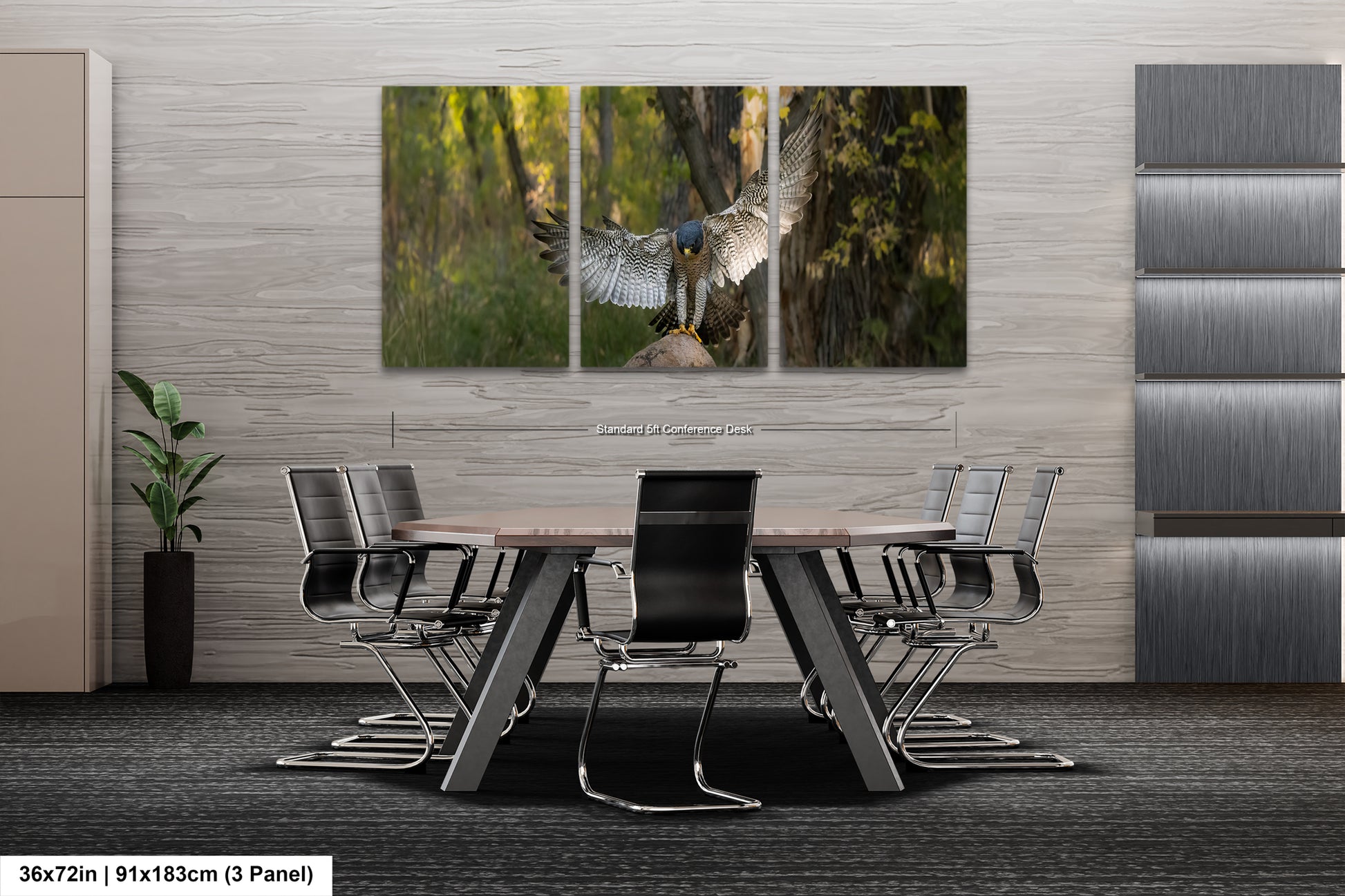 A modern office space with a large, three-panel artwork depicting a bird in flight above a forest scene. The artwork is mounted on a gray wall above a wooden table surrounded by black chairs.
