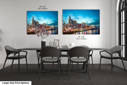 a dining room table with four chairs and a painting on the wall