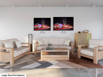 a living room with two pictures on the wall