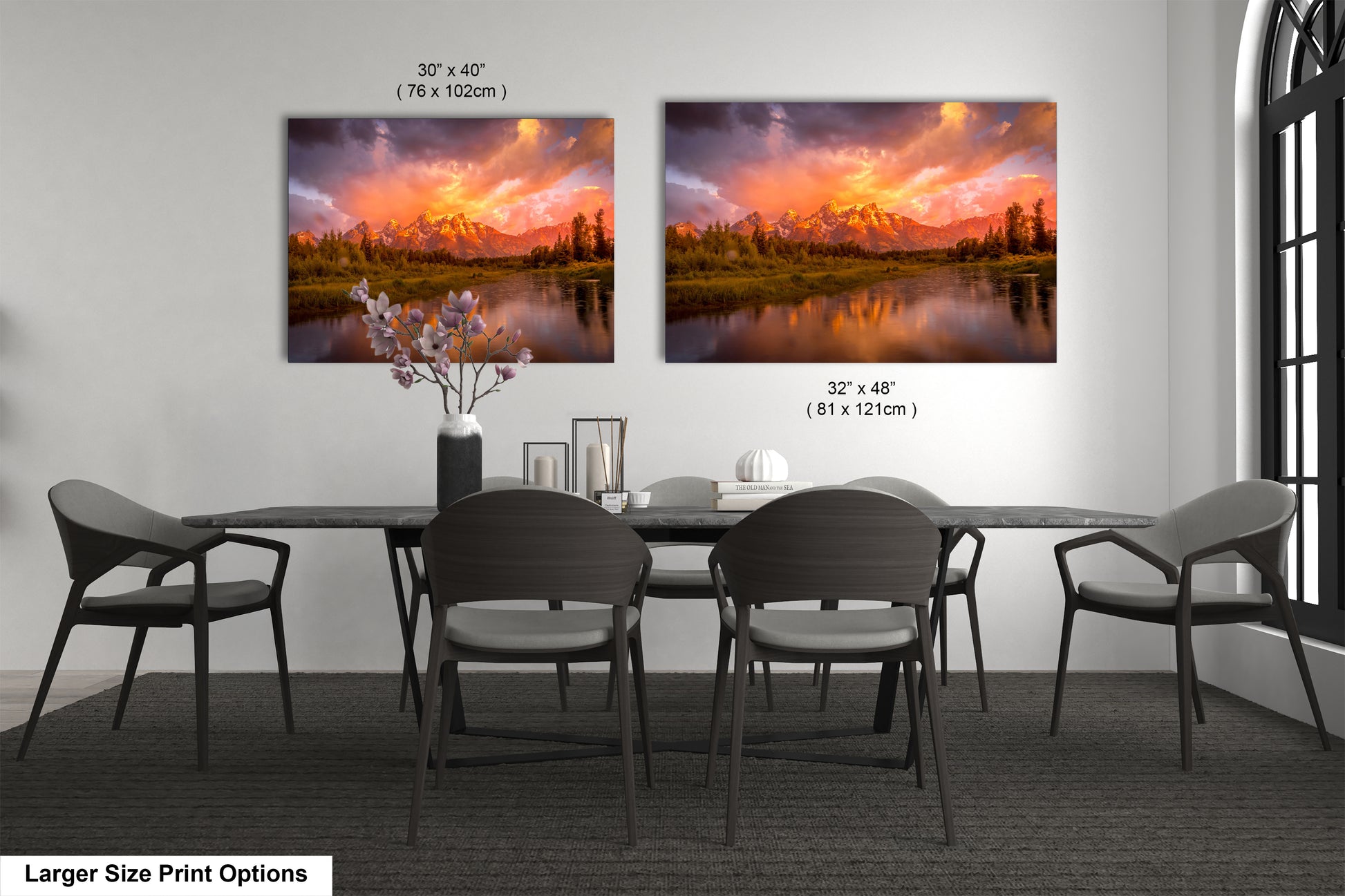 a dining room table with four chairs and a painting on the wall