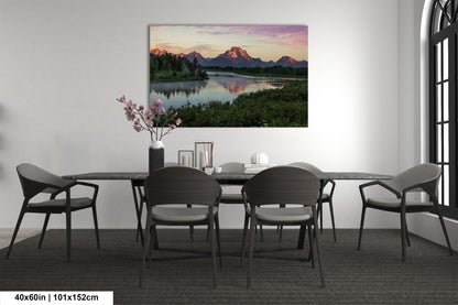 a dining room with a table and chairs