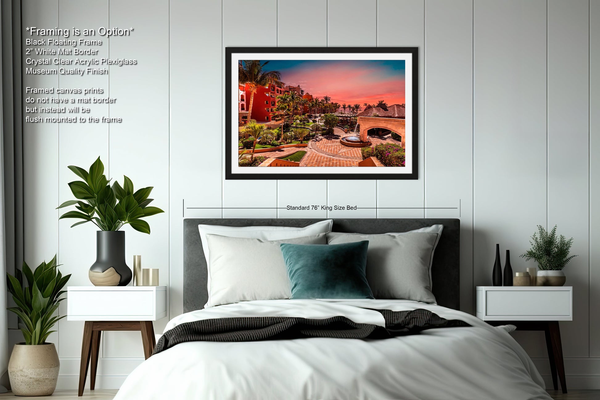 a bedroom with a bed and a picture hanging on the wall