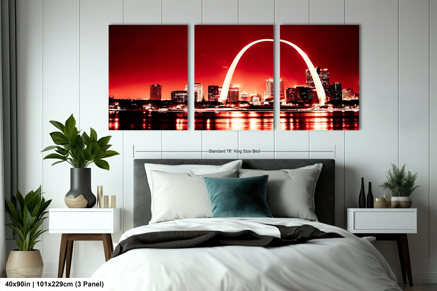 a bedroom with a bed and a picture of the st louis skyline