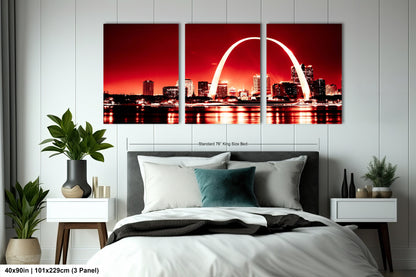 a bedroom with a bed and a picture of the st louis skyline