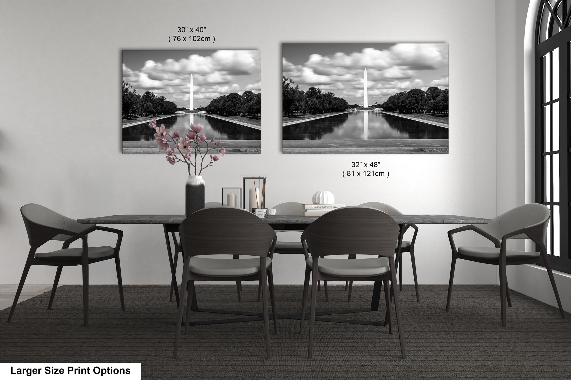 a black and white photo of a table and chairs