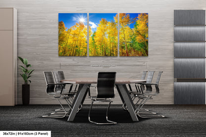 a dining room table with chairs and a painting on the wall