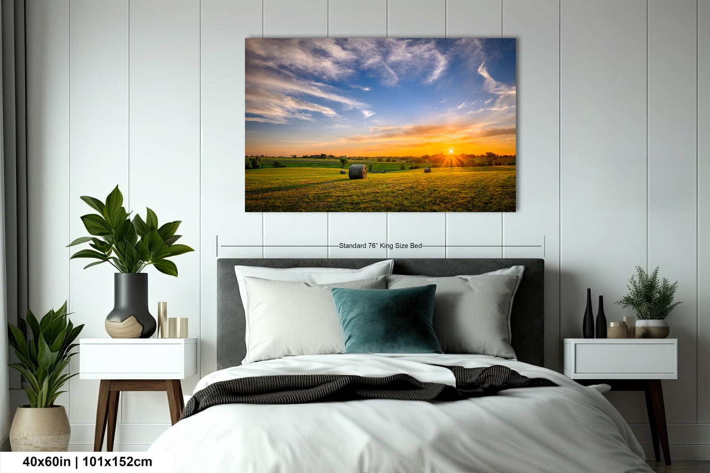 a bed room with a neatly made bed and a painting on the wall