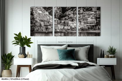 a black and white photo of a bed in a bedroom