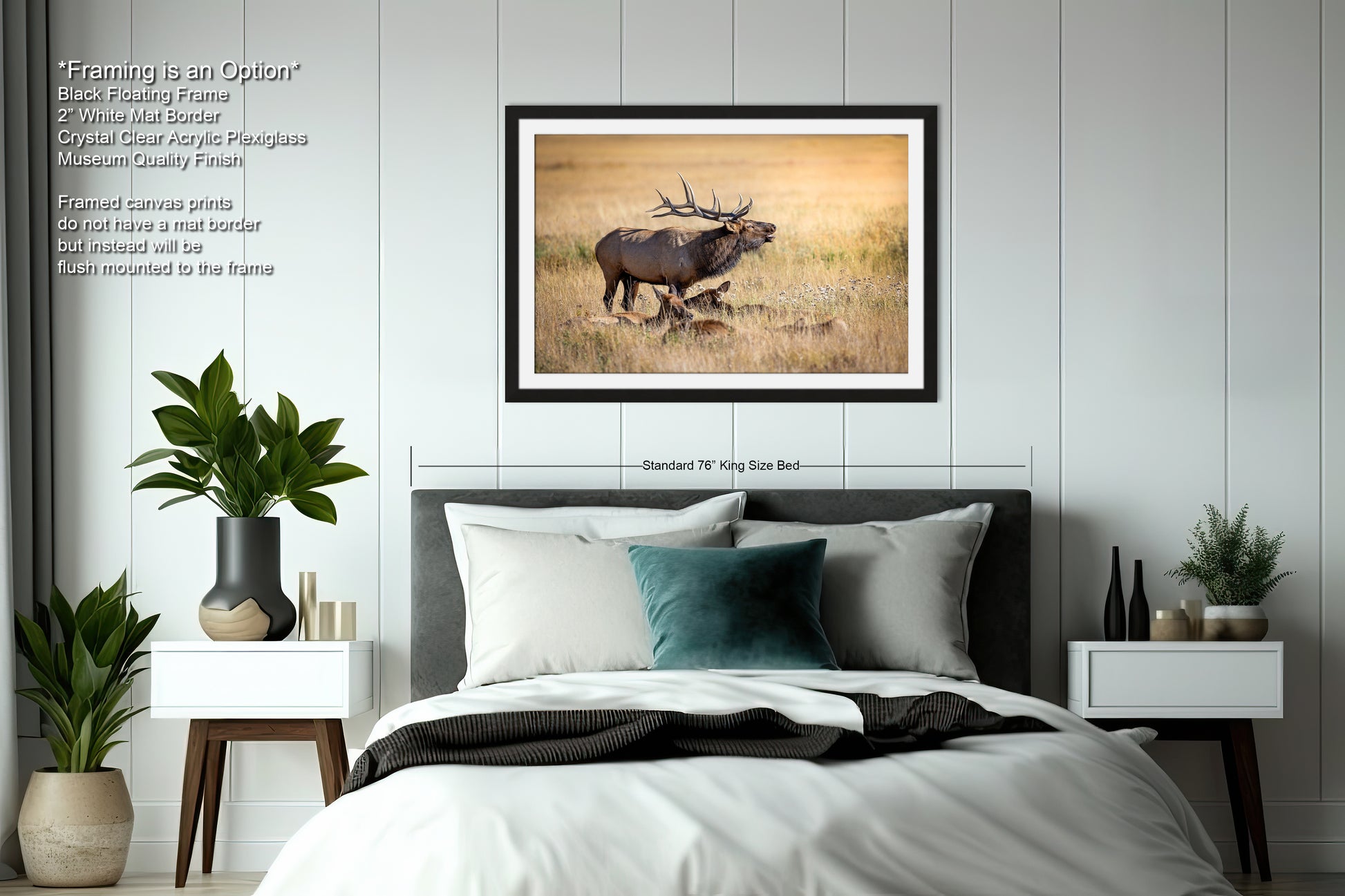 a bed with a picture of a deer on the wall above it