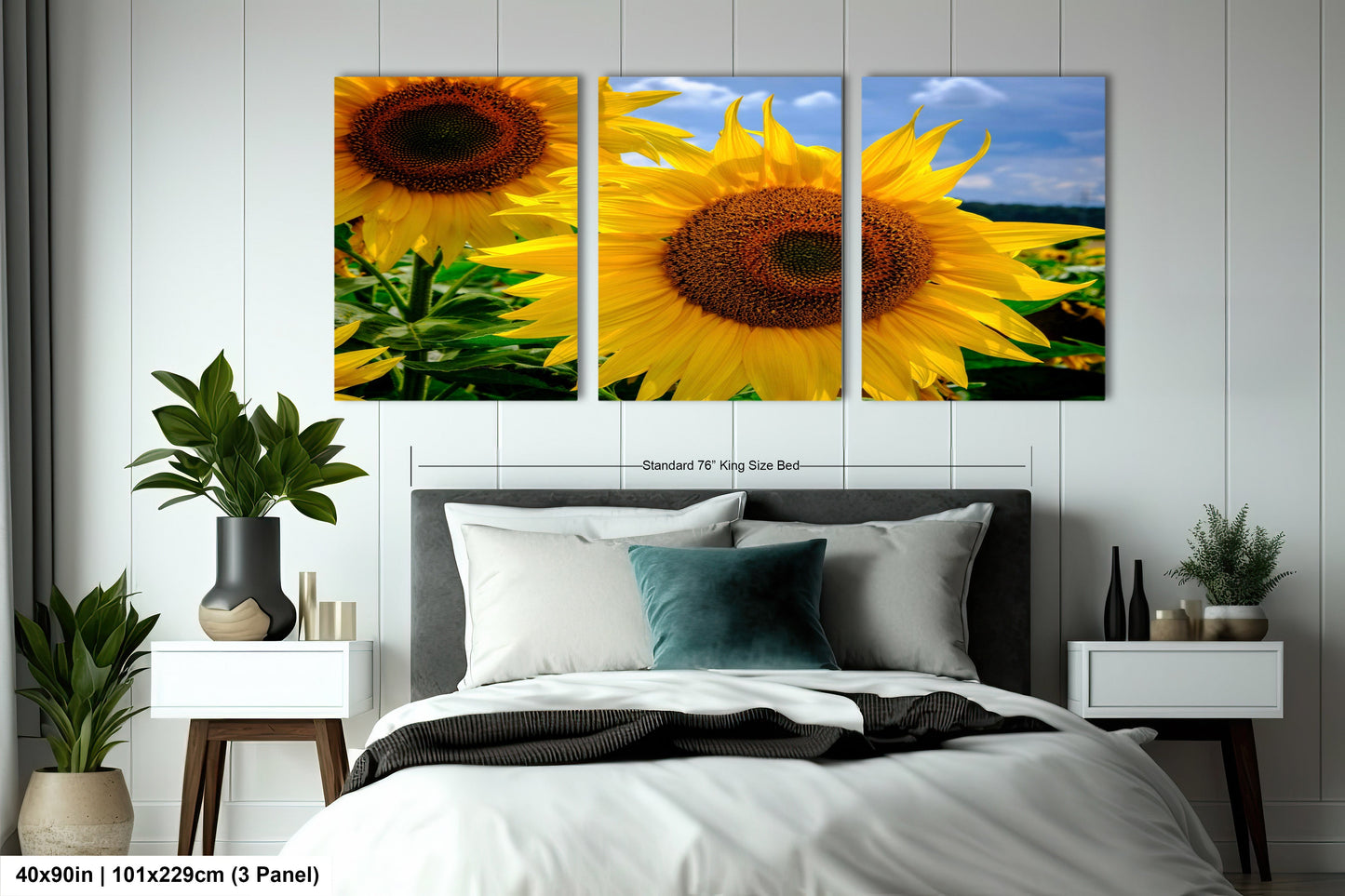 a bedroom with a bed and two sunflowers on the wall
