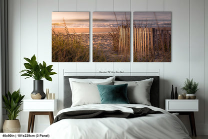 a bedroom scene with focus on the bed and the ocean