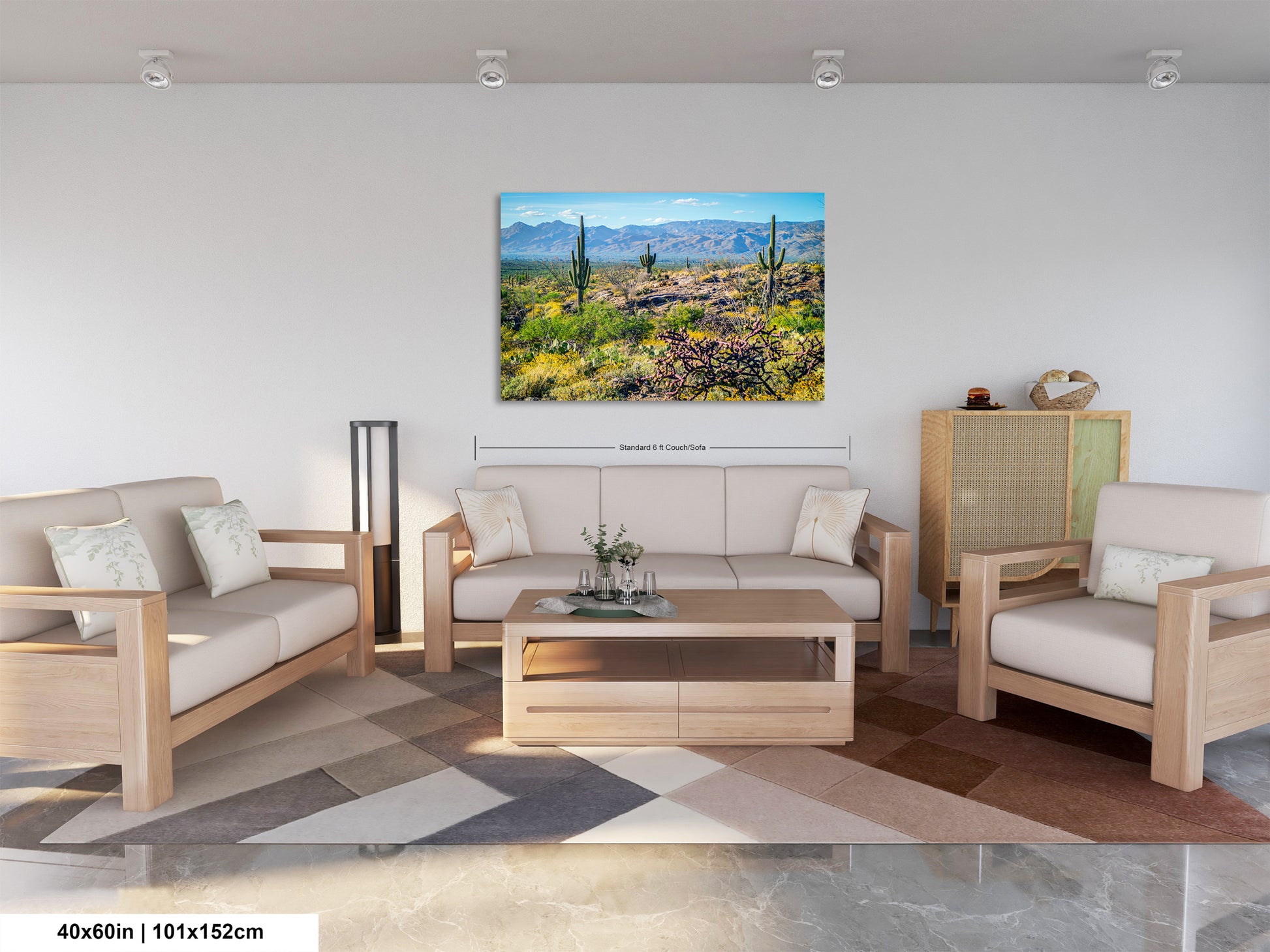 a living room with a large, colorful painting of a desert landscape hanging on the wall. The painting features a desert scene with cacti, mountains, and a clear blue sky. The living room is furnished with a sofa, two chairs, and a coffee table, creating a cozy and inviting atmosphere.