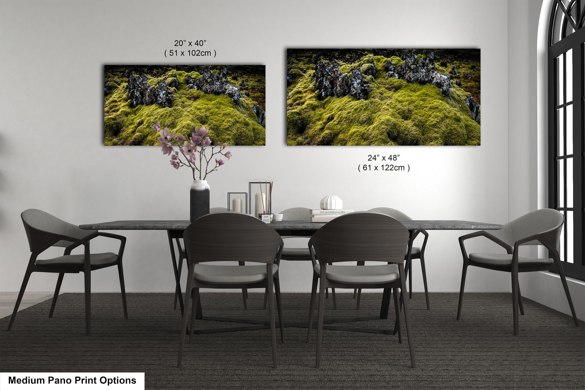 a dining room table with four chairs and a vase of flowers