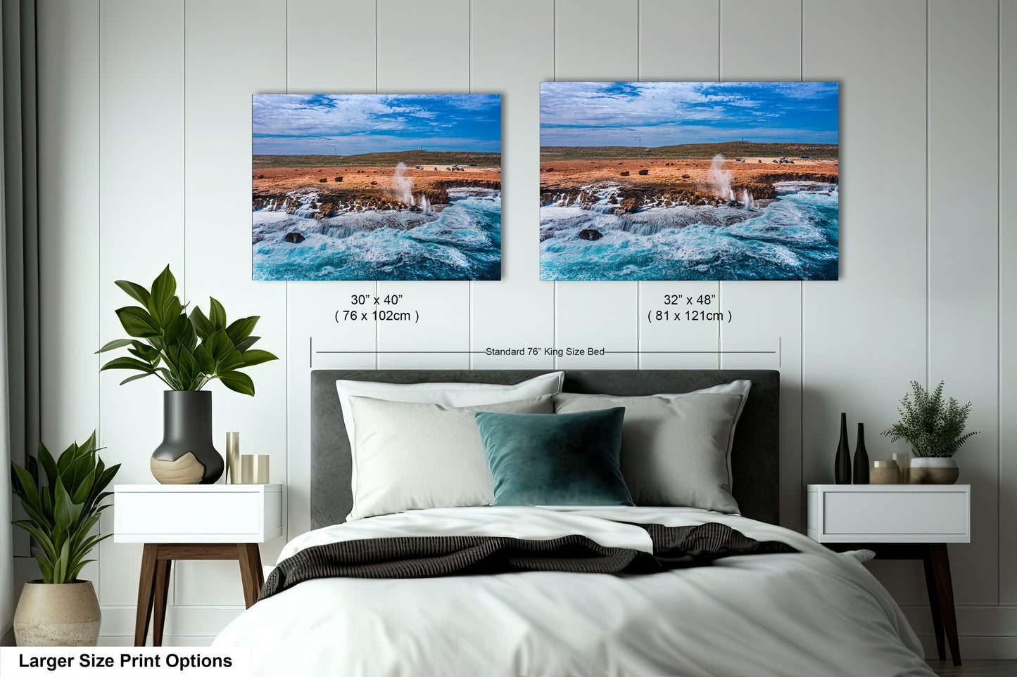 a bedroom with a bed and two pictures on the wall