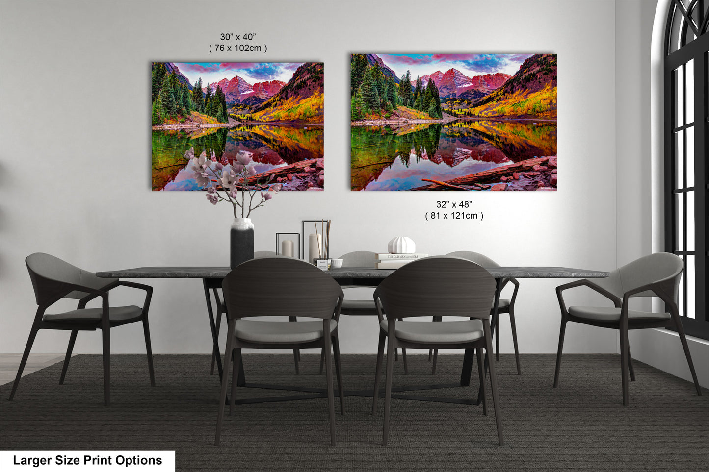 a dining room table with chairs and a painting on the wall