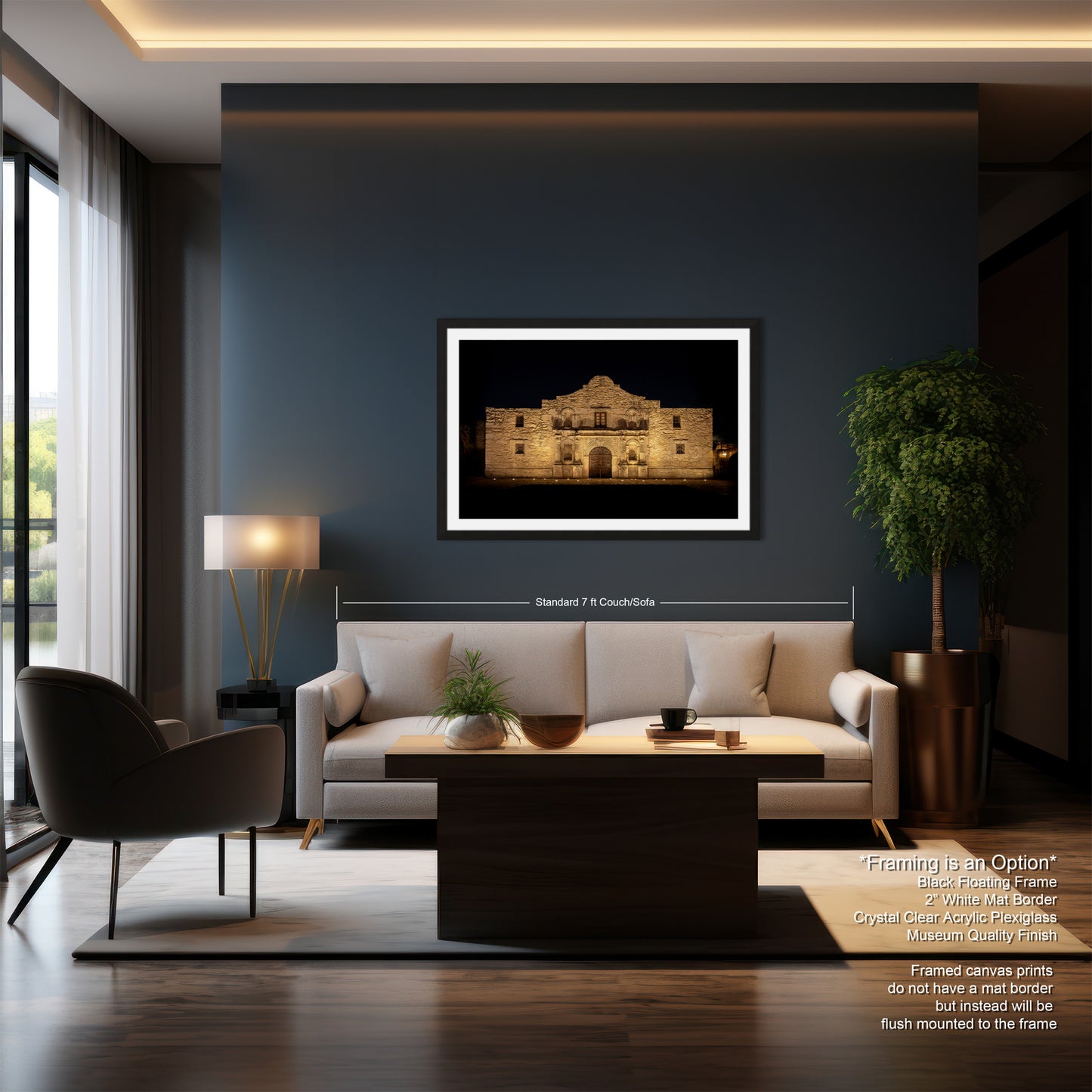 a modern living room with a large framed picture of a building on the wall, a white sofa, a wooden coffee table, and a large window.