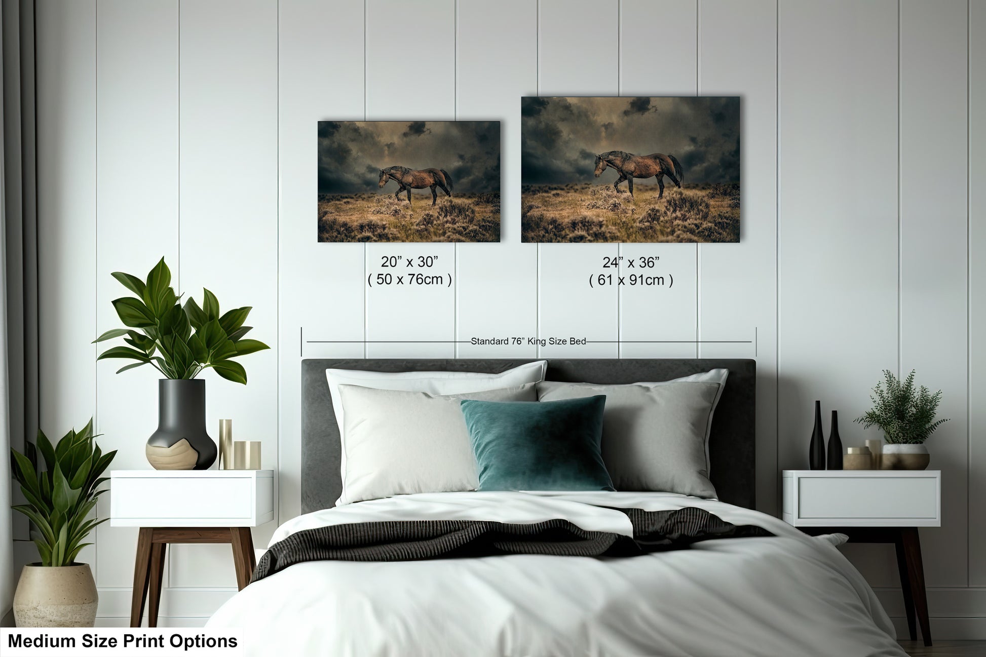 a bed with two pictures of horses on the wall above it