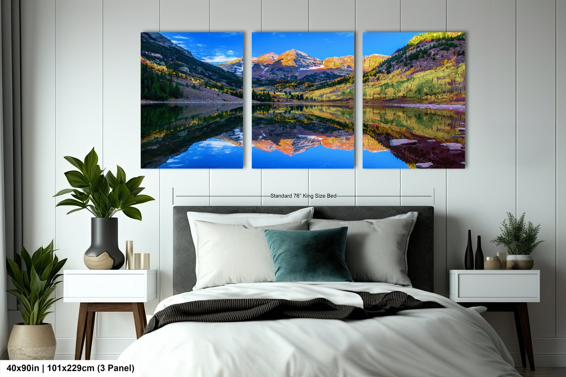 a bedroom with a bed and two paintings on the wall