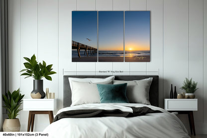 a bedroom scene with focus on the bed and the ocean
