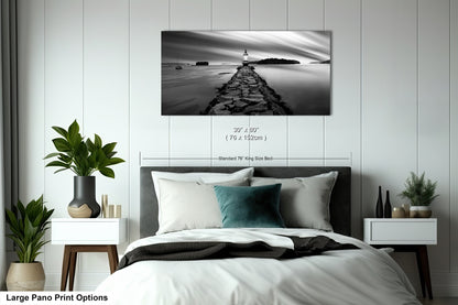 a black and white photo of a bedroom with a bed
