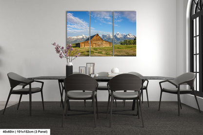 a dining room with a table and chairs