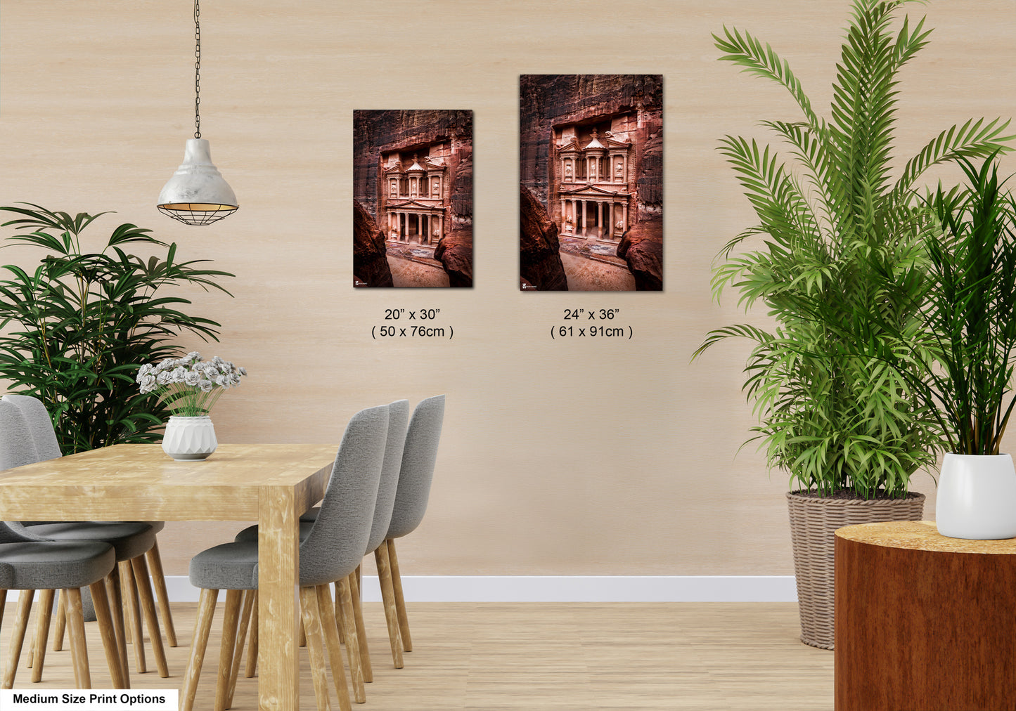 a room with a table and chairs and two pictures on the wall