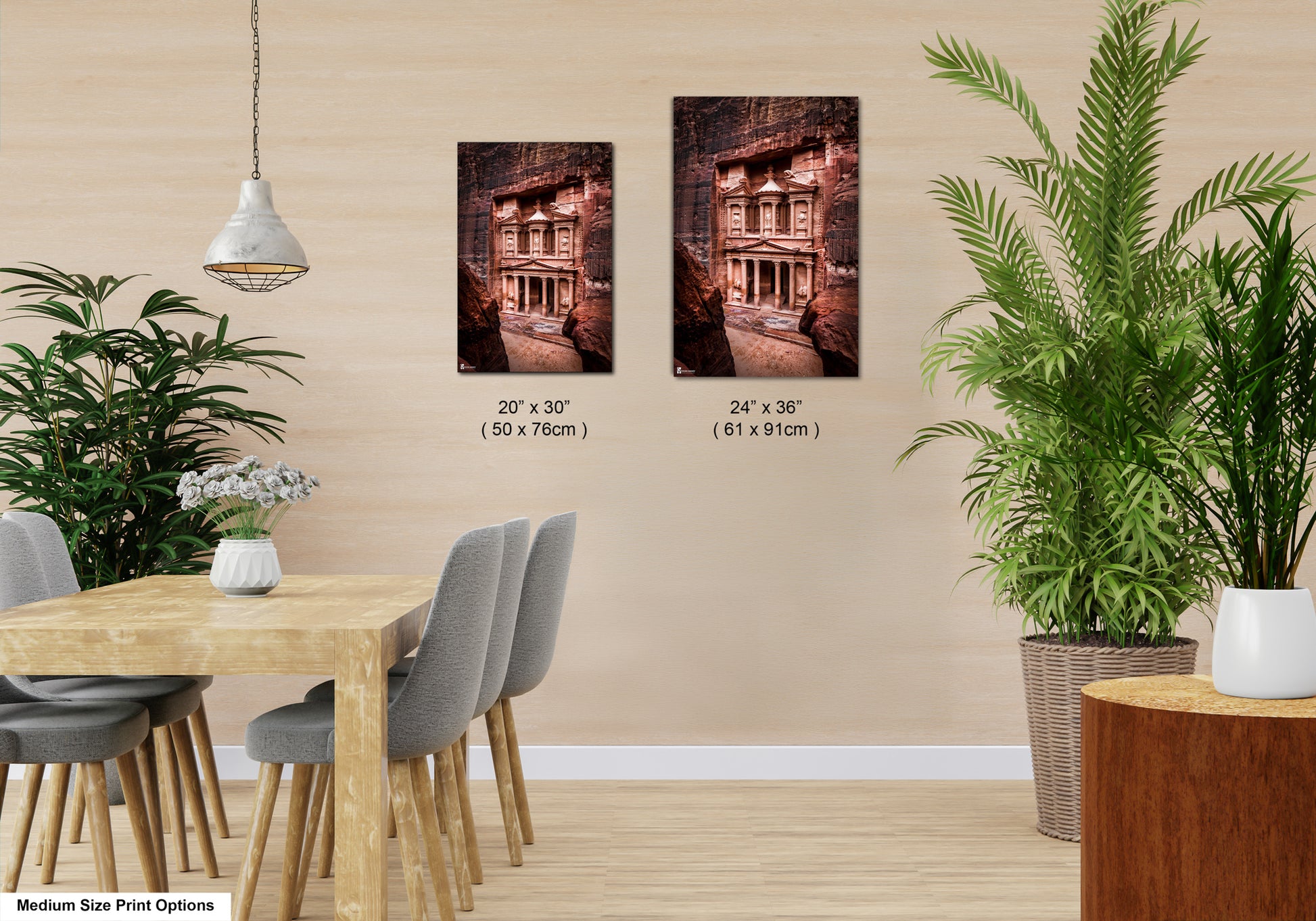 a room with a table and chairs and two pictures on the wall