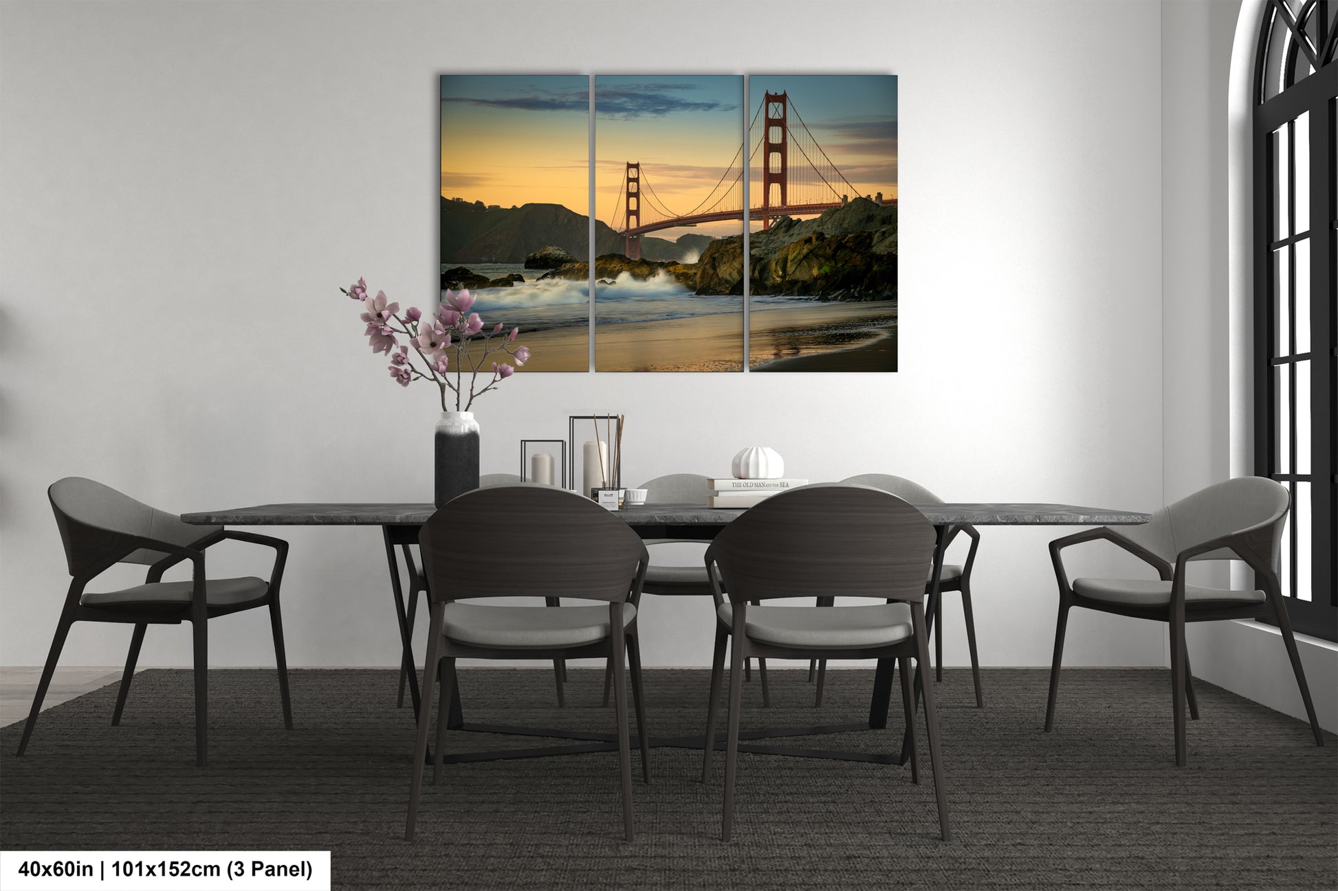 a dining room with a table and chairs and a picture of the golden gate bridge
