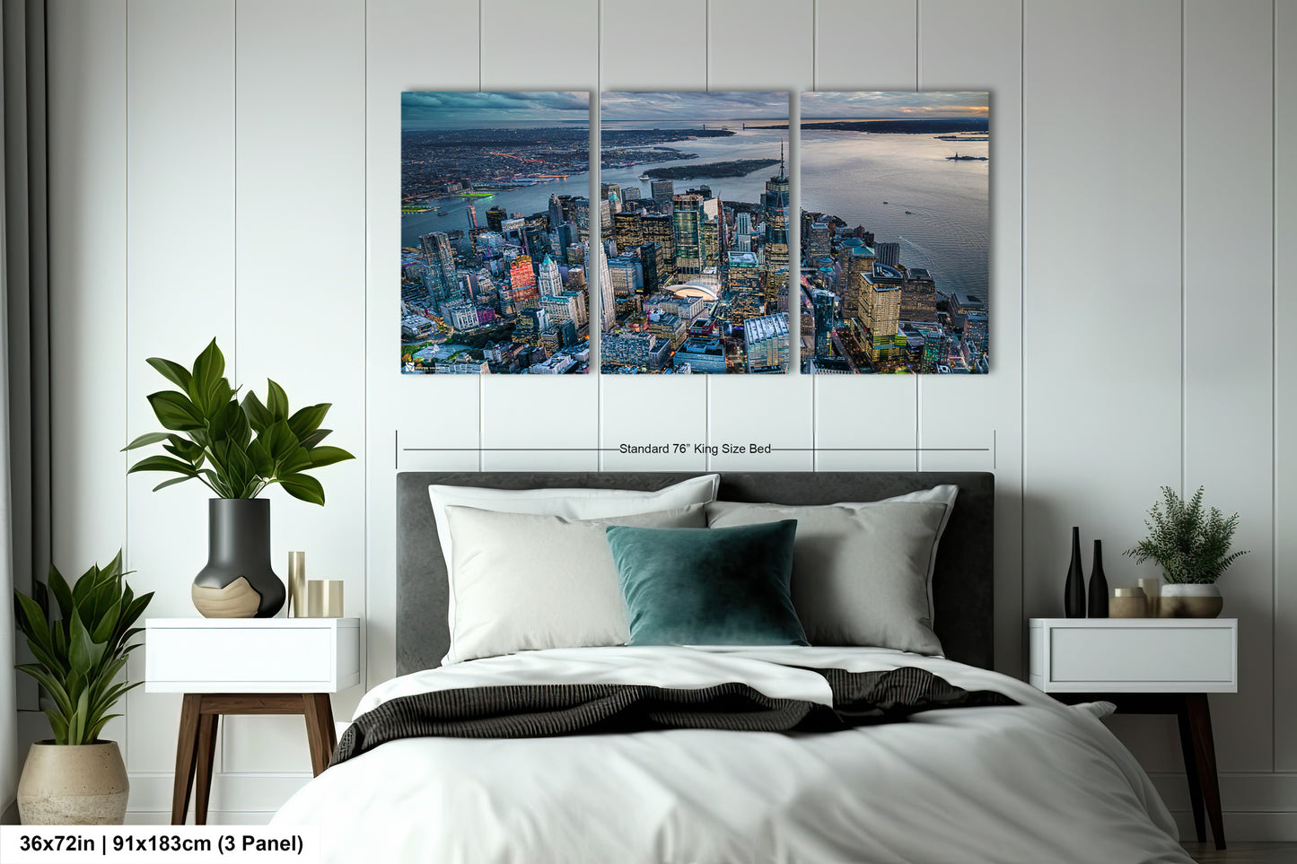 a bedroom with a bed and two paintings on the wall