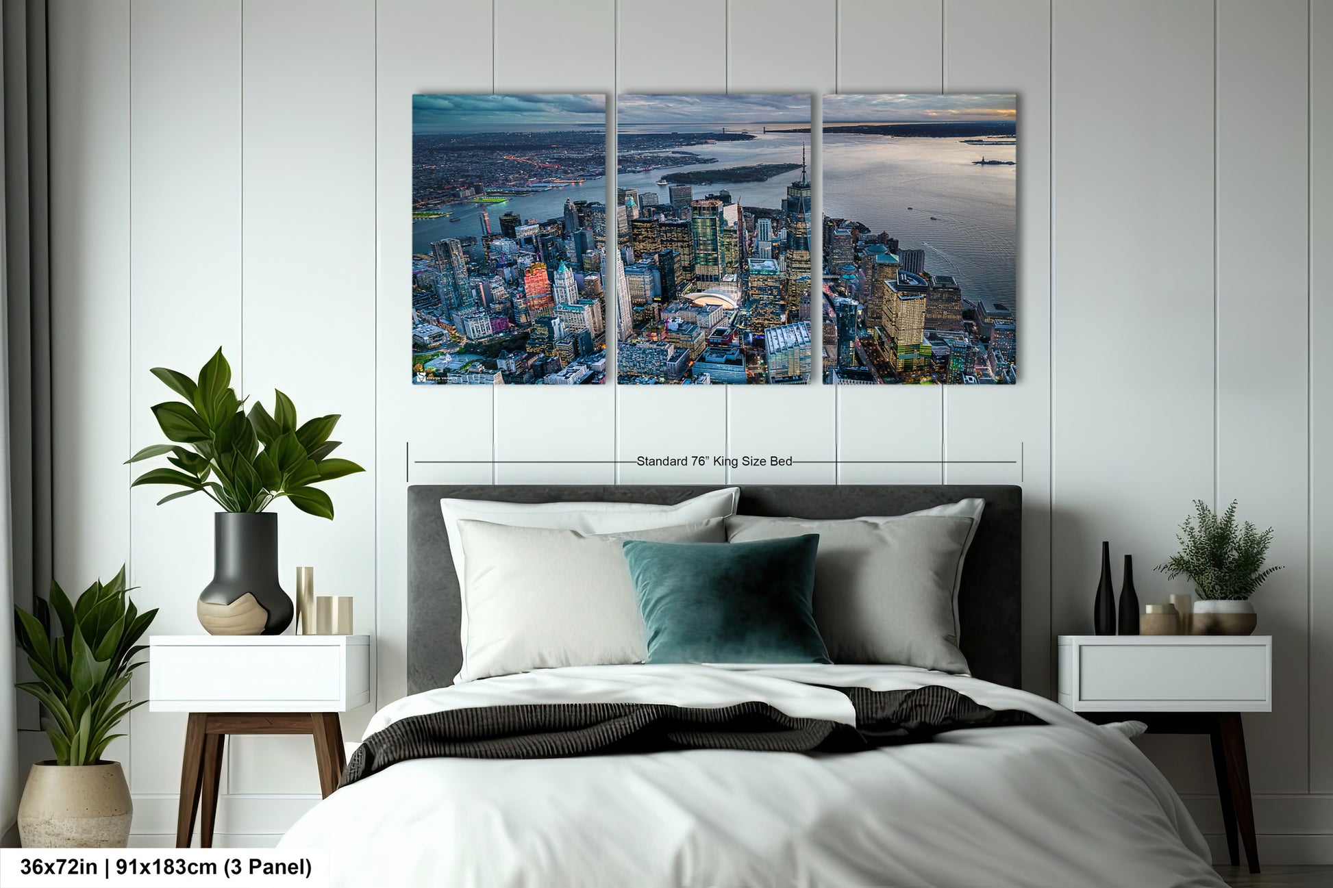 a bedroom with a bed and two paintings on the wall