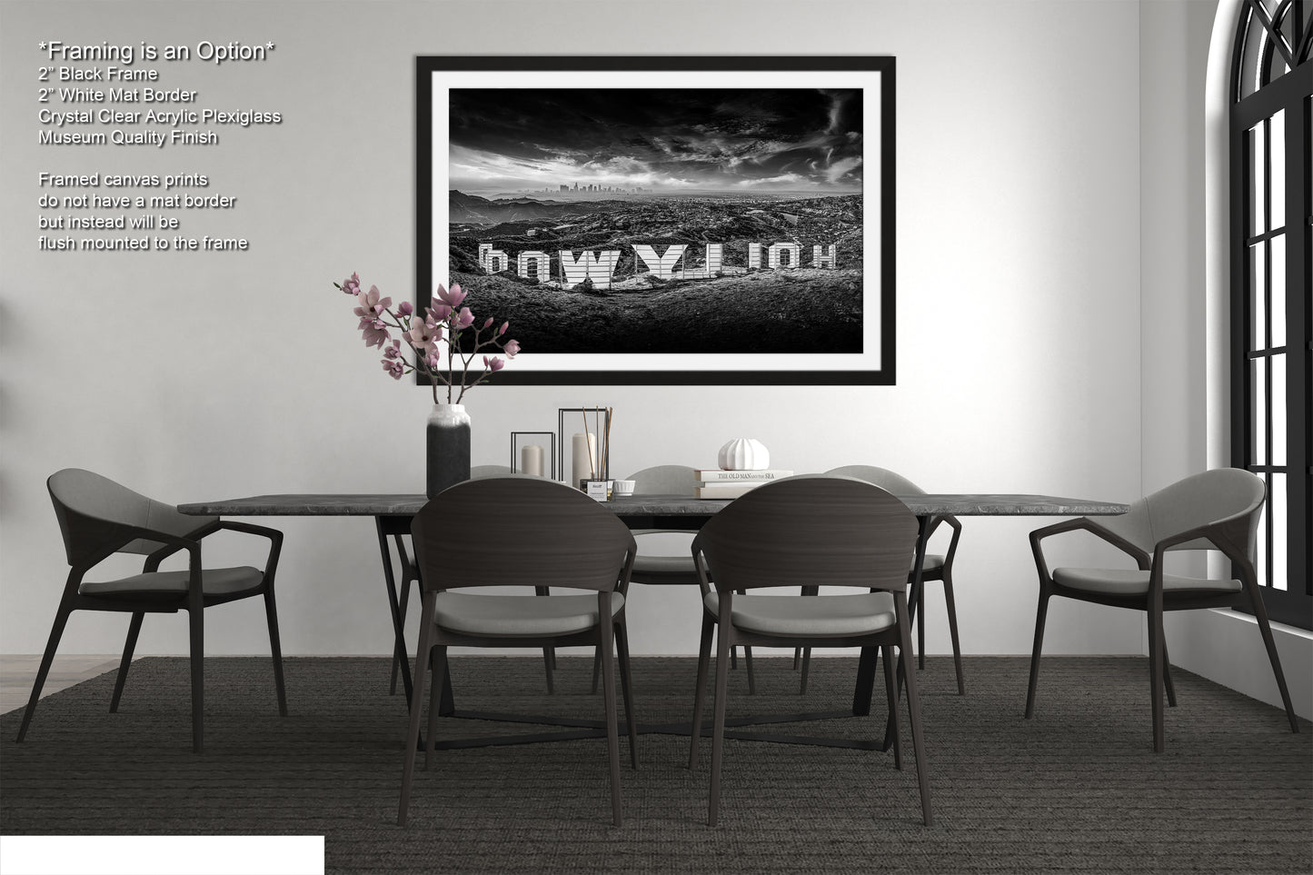 a black and white photo of a table and chairs