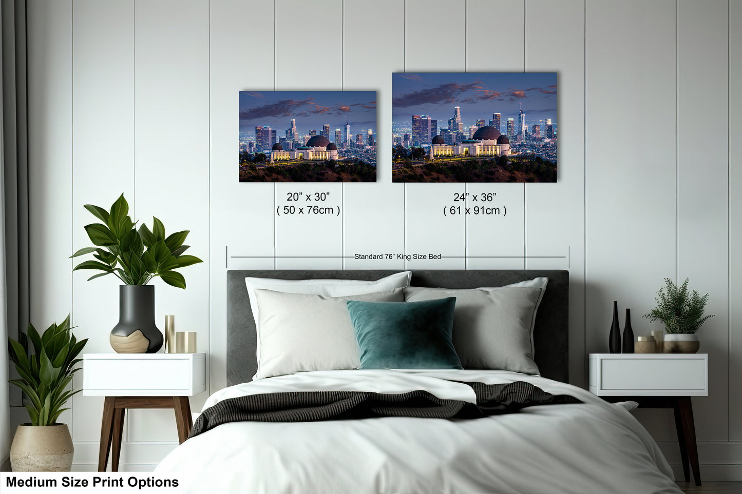 a bedroom with a bed and two pictures on the wall