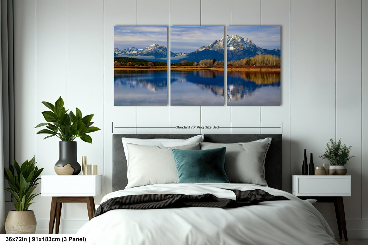 a bedroom with a bed and two paintings on the wall