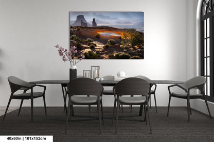 a dining room with a table and chairs and a painting on the wall