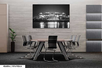 a black and white photo of a city at night