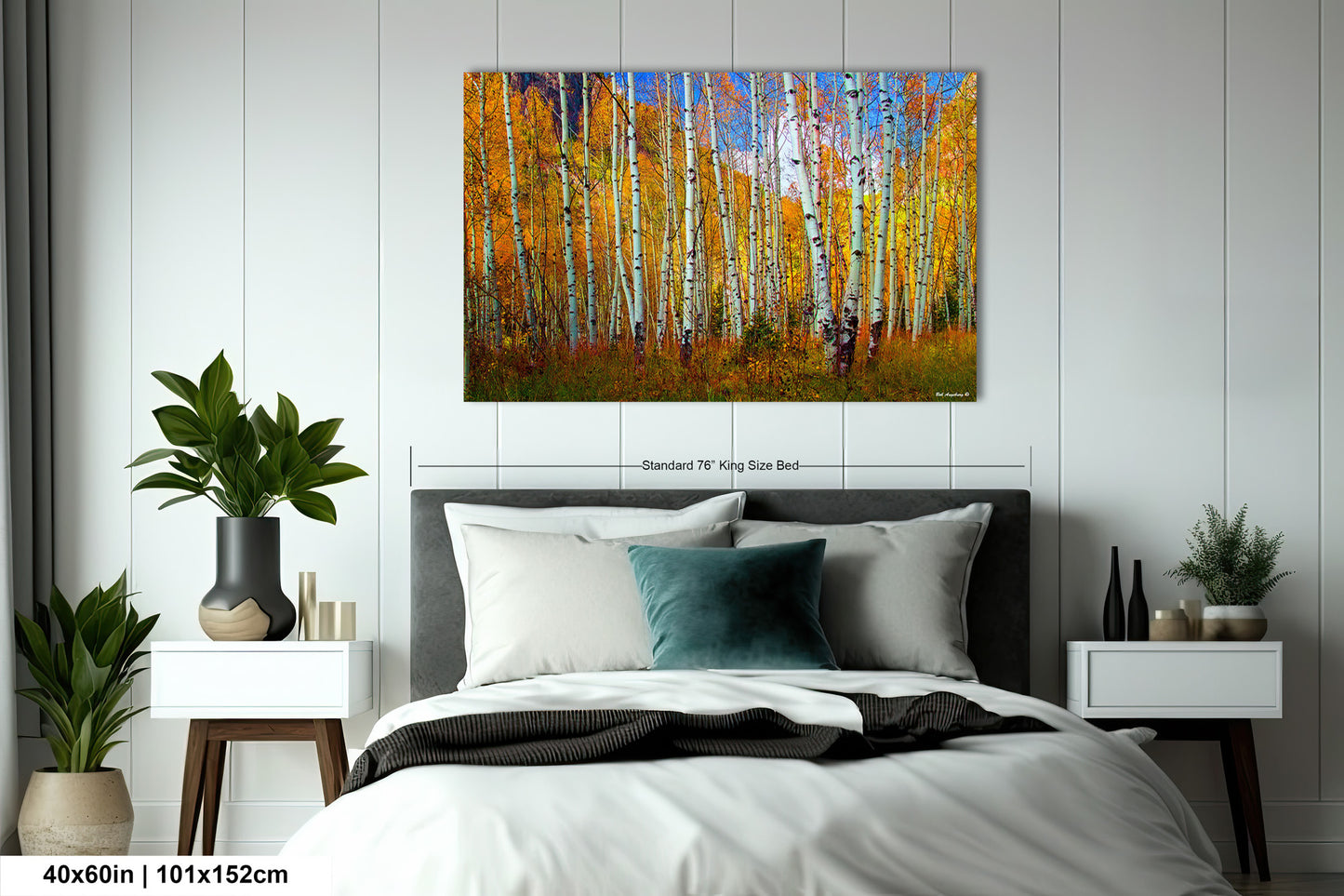 a bedroom with a bed and a painting on the wall