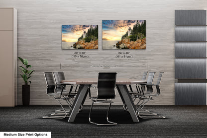 a dining room table with four chairs and two pictures on the wall