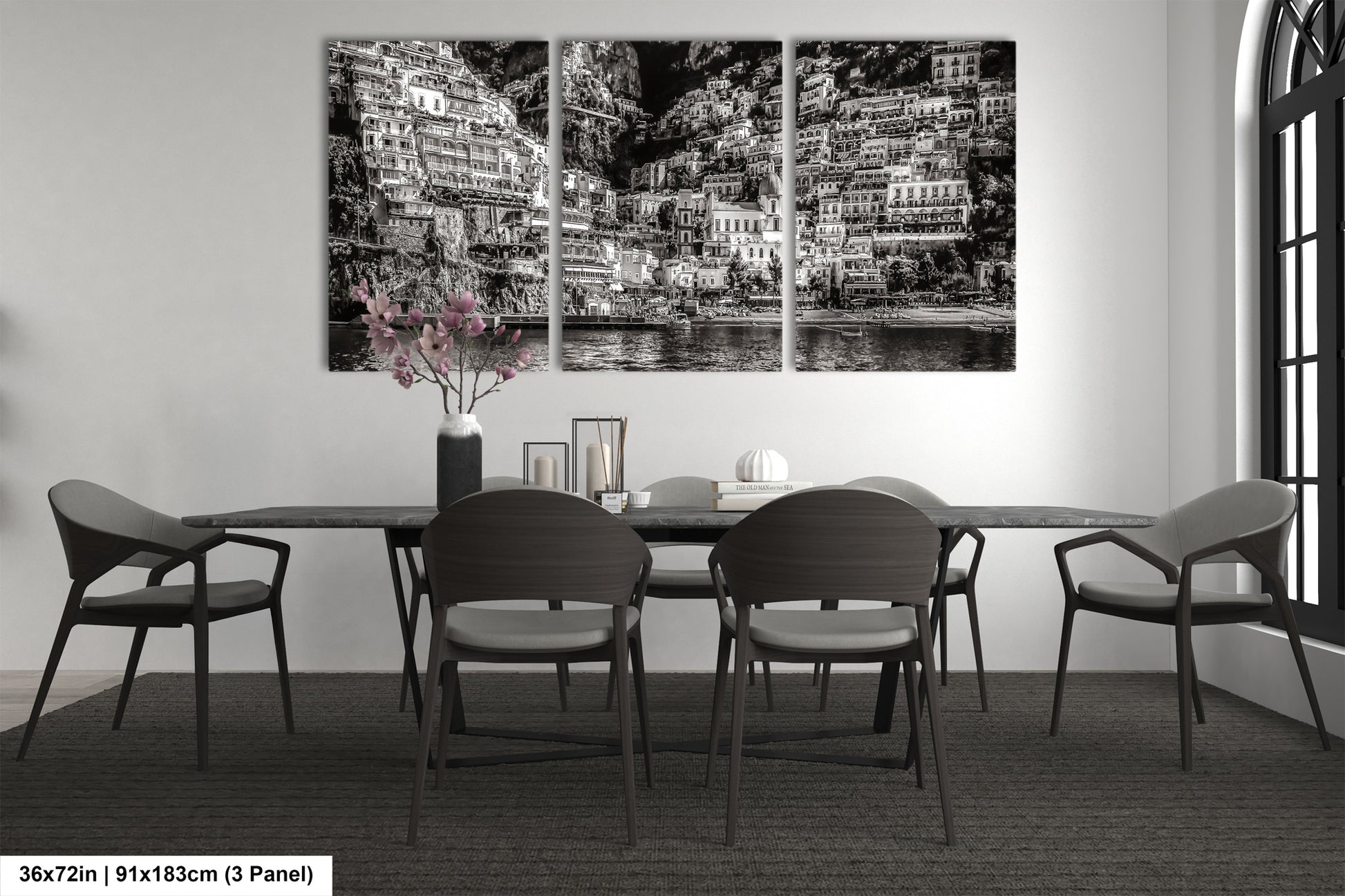 a black and white photo of a dining room table