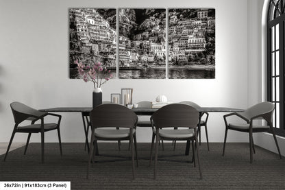 a black and white photo of a dining room table