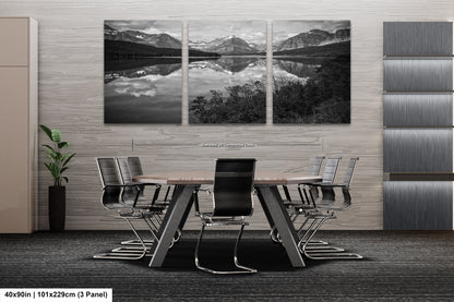 a black and white photo of a table and chairs