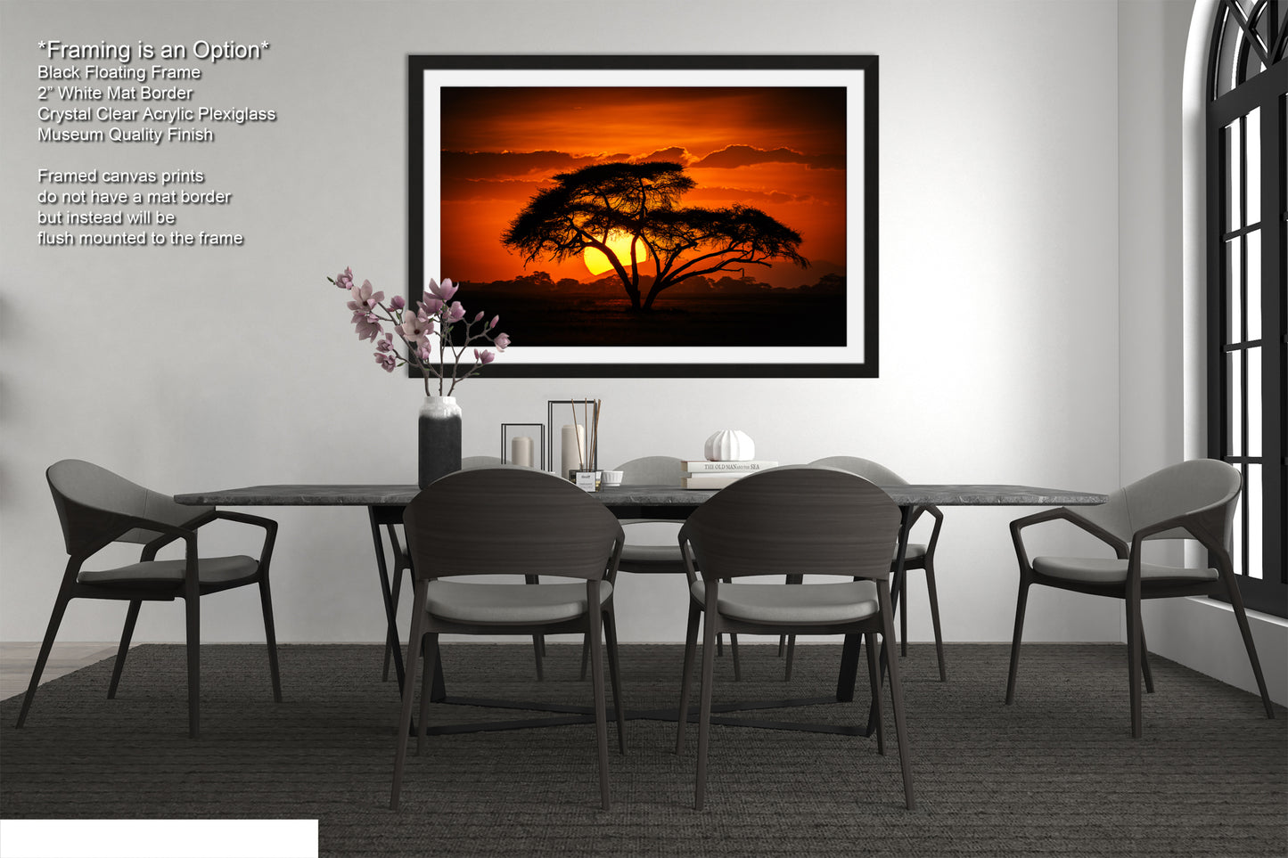 a picture of a table with chairs and a vase of flowers