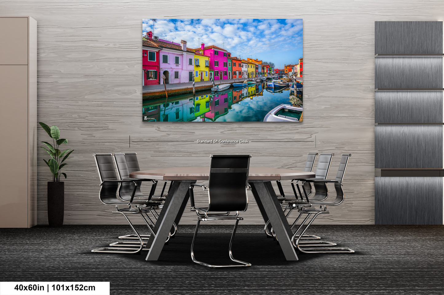 a dining room table with chairs and a painting on the wall