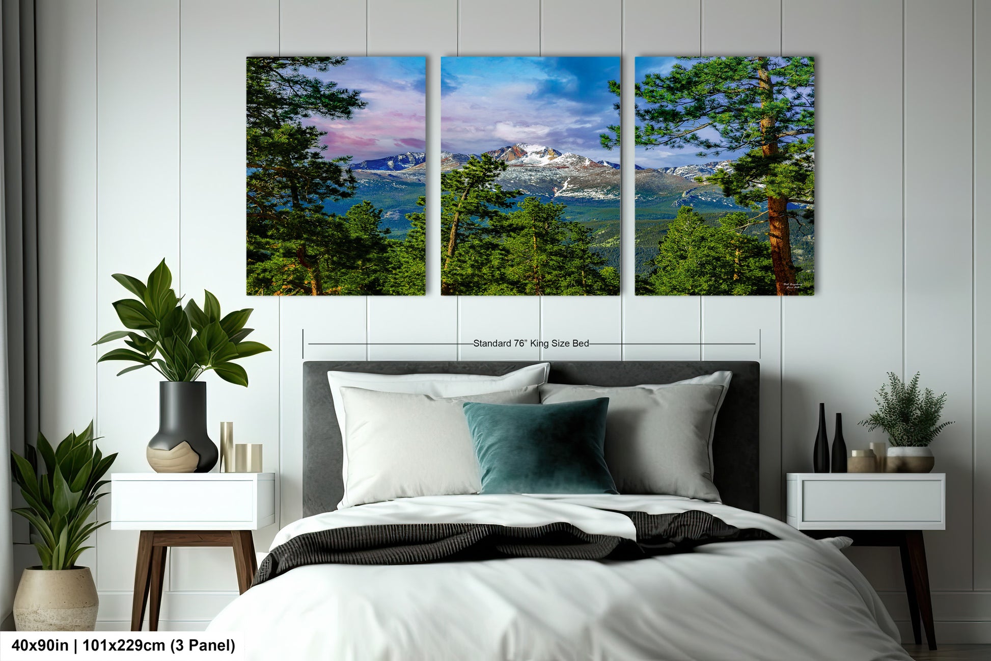 a bedroom with a bed and two paintings on the wall