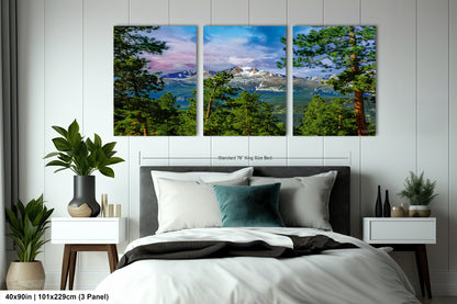 a bedroom with a bed and two paintings on the wall