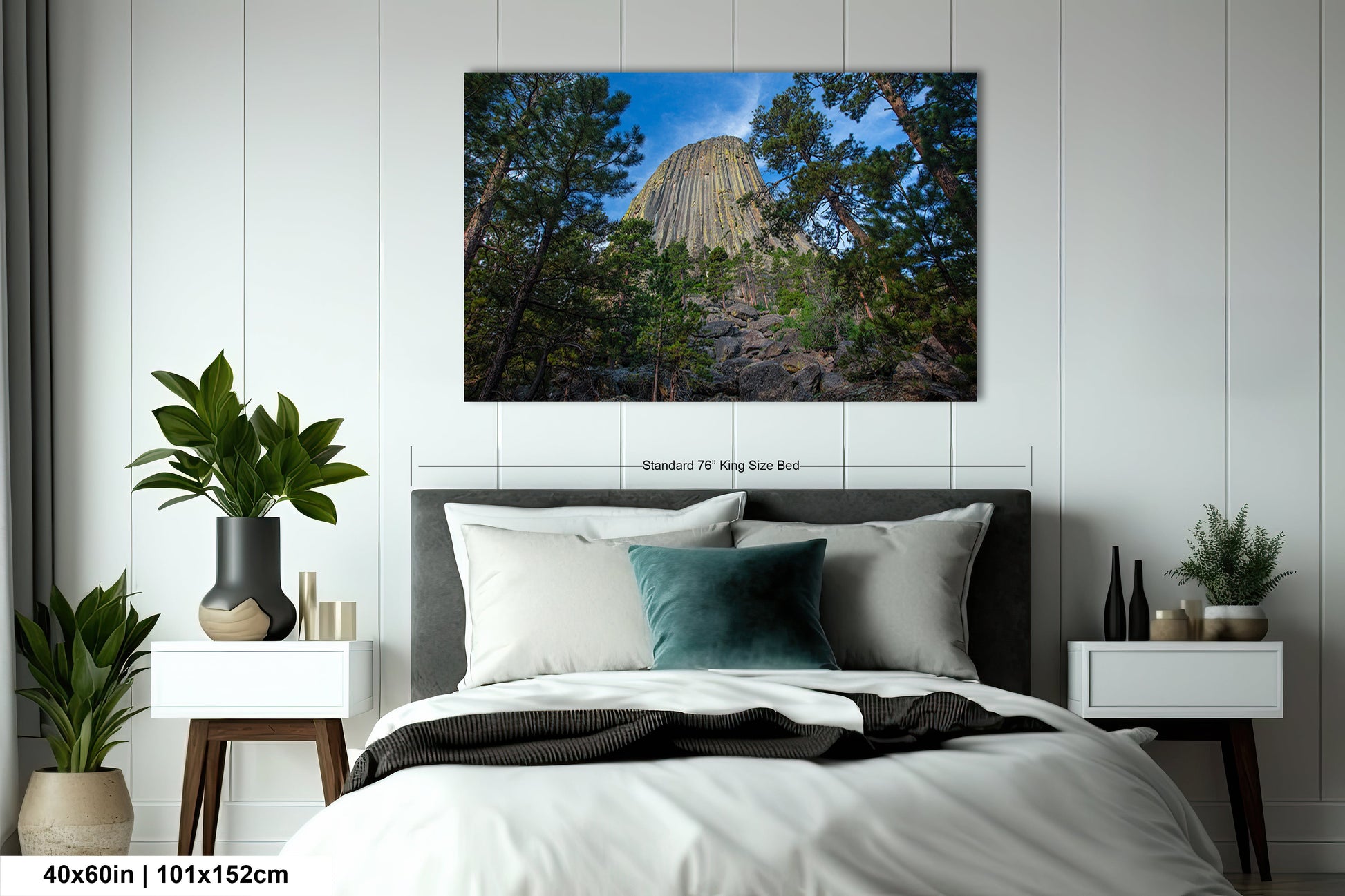a bed in a bedroom with a picture on the wall above it